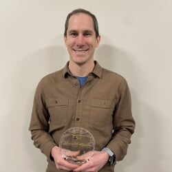 Robert Handler holds Bayard Rustin Award