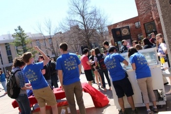 Students in blue shirts gathered near the Memorial Union.