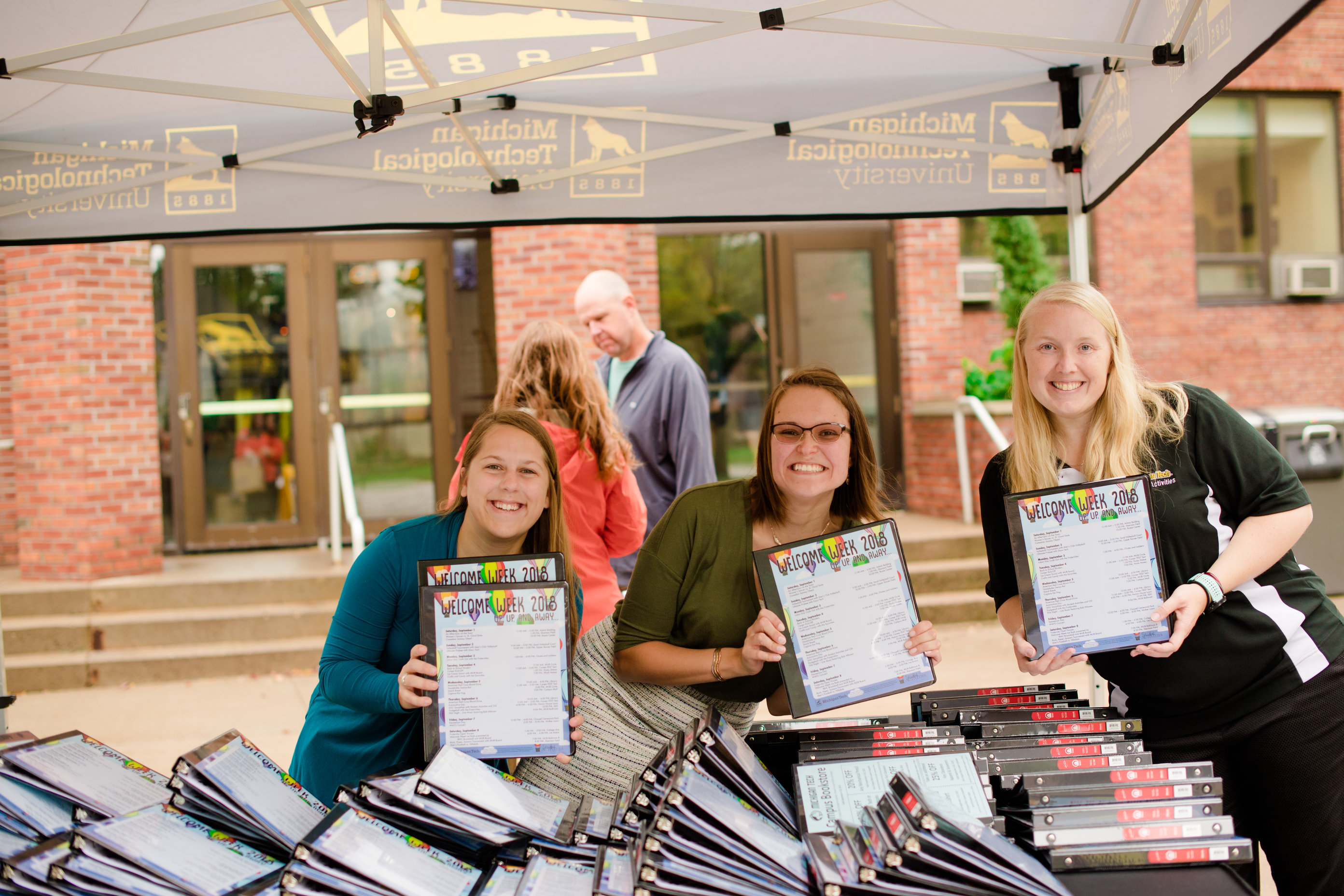 Handing out Binders 