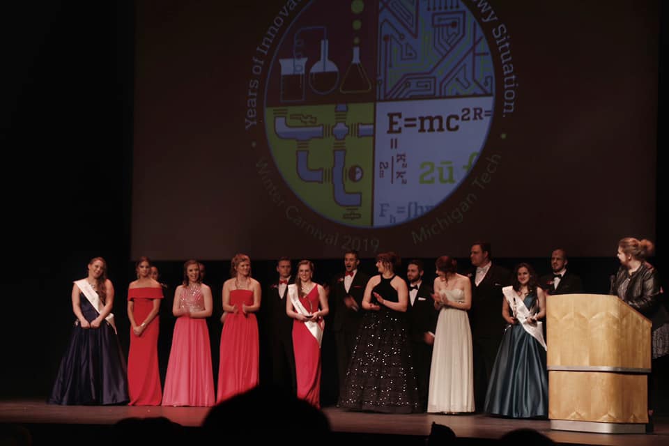 Image of Pagent with Students formally dressed.