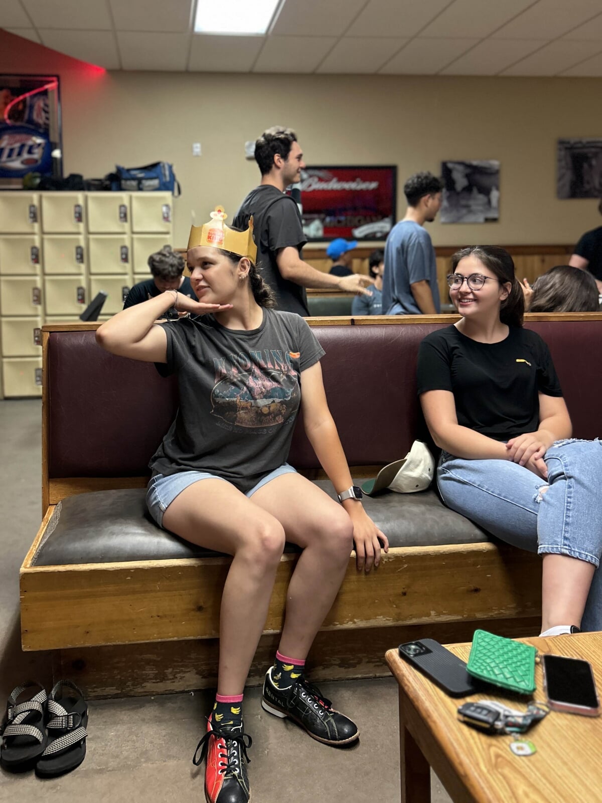 An S-STEM student wearing a paper crown while bowling.