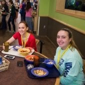Two young women eating lunch