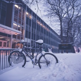 Even as the snow piles up, intrepid students bike to class.