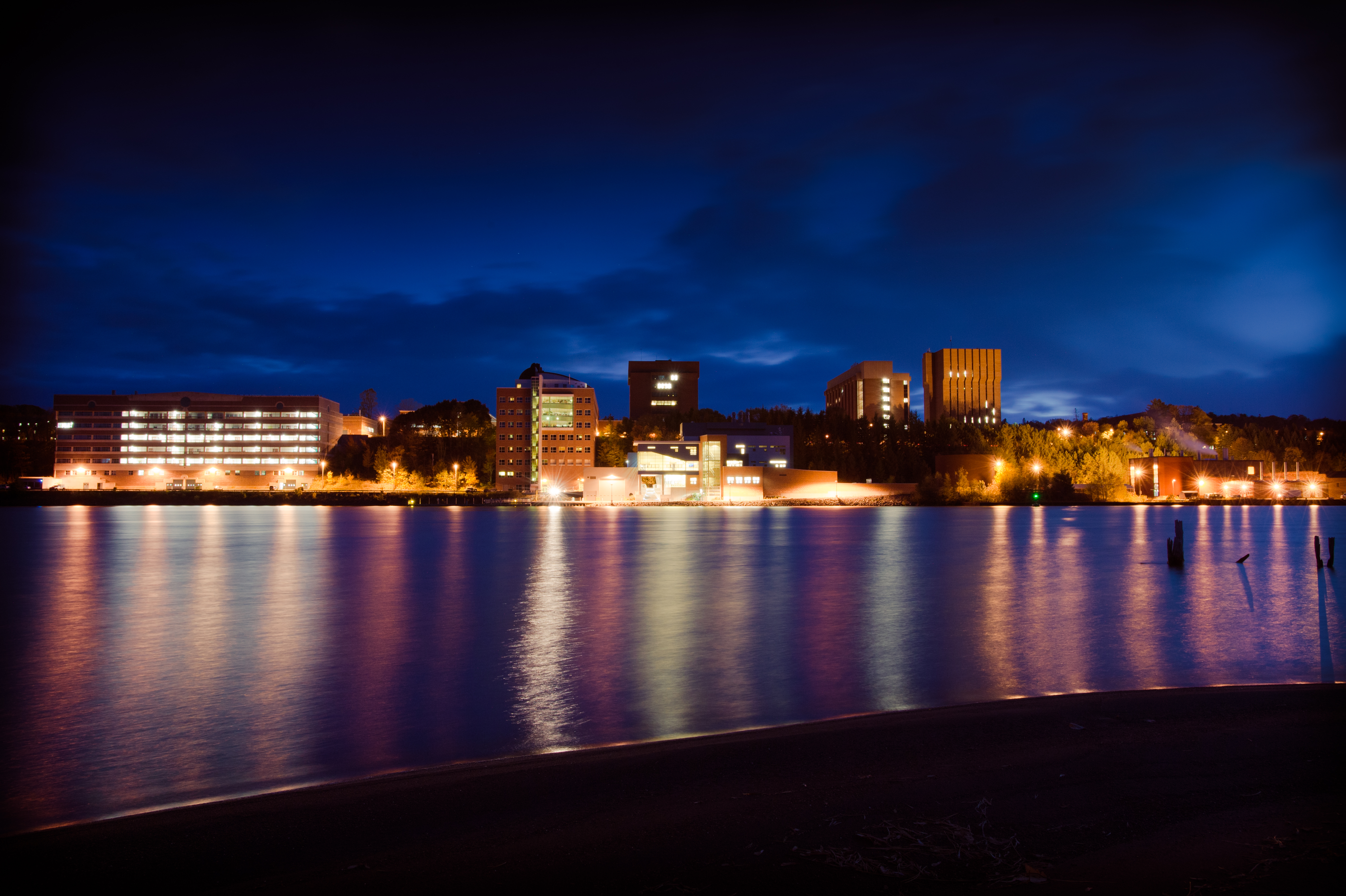 Michigan Tech across Portage Waterway at night