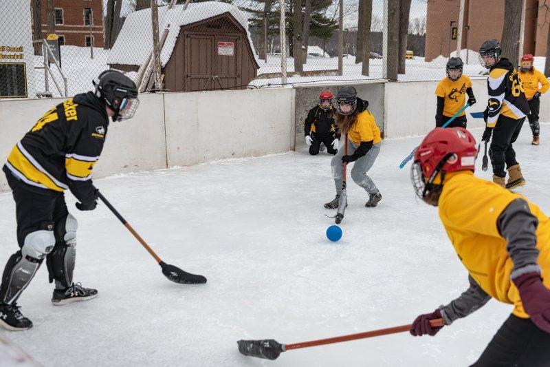 Students playing broomball.