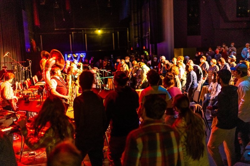 Audience on the stage during a jazz concert.