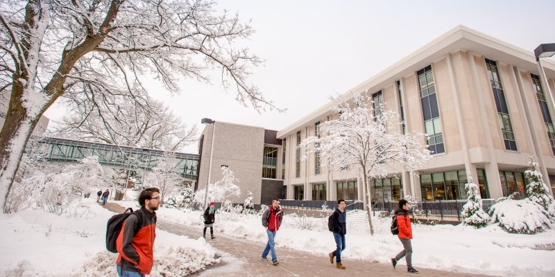 Students walking outside the Library.