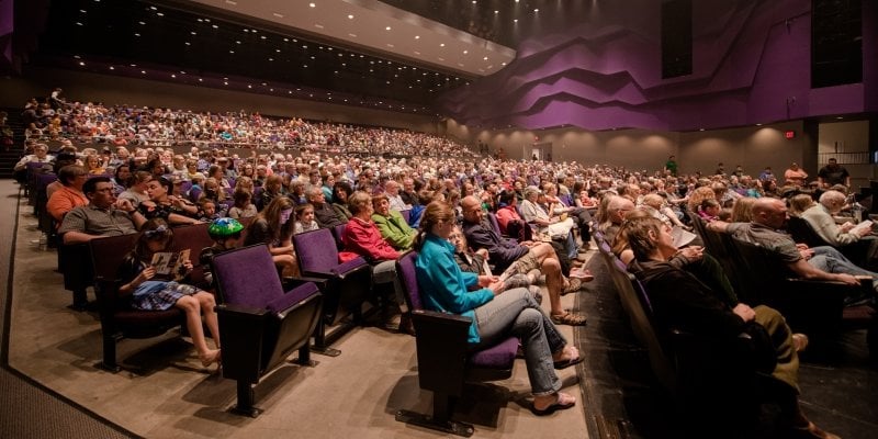 People sitting in the theater.