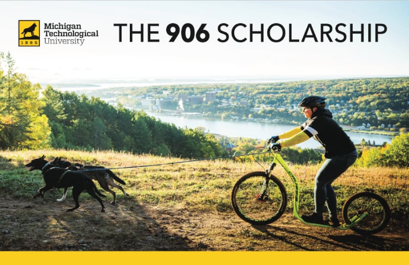 Postcard for The 906 Scholarship with a person biking with dogs on top of a hill looking across the waterway from campus.