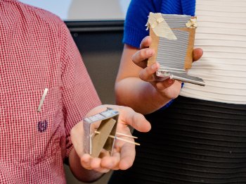 The design of a barrier may seem quaint in cardboard, but it saves lives in metal guardrails. 