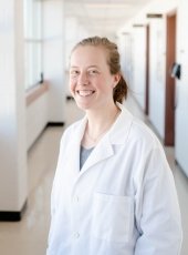 woman in white lab coat