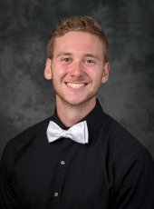 man in black shirt and white bowtie