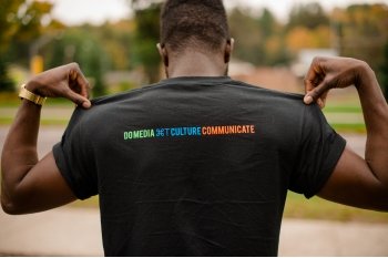 man wearing a Community Culture Media shirt