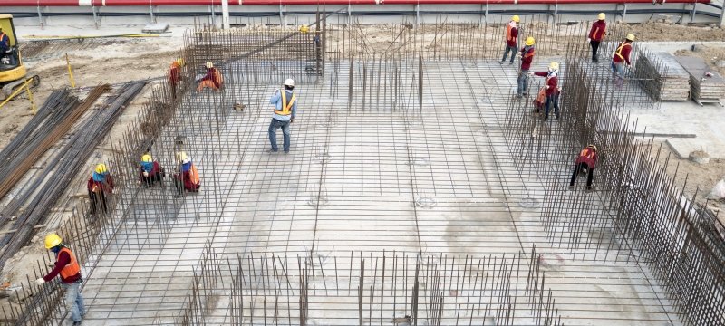 skyscraper under construction with workers