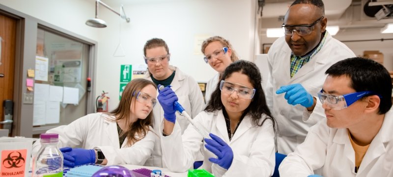 group of people in lab coats
