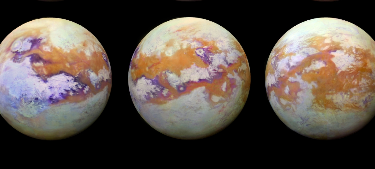 Satellite image of Titan shows a swirling orange mass of clouds at the moon’s north pole.