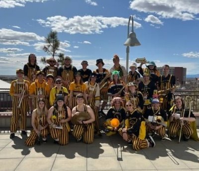 The MTU Huskies Pep Band in their black and gold stripes