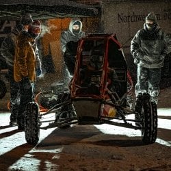 Students gather for the start of the Baja Winter Invitational on a chilly January morning at Michigan Tech in the snow.