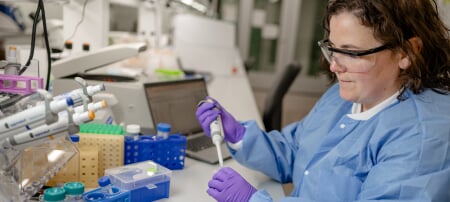 Aimee Marceau, lead for Michigan Techâ€™s Genomic Sequencing Lab, demonstrates the capabilities of the lab, which serves as a top-tier resource for researchers and businesses in the region and elsewhere.