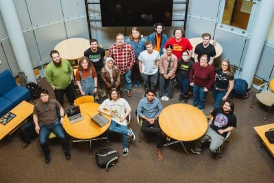 CS Education Research Group sitting in the round study room looking up at the camera.