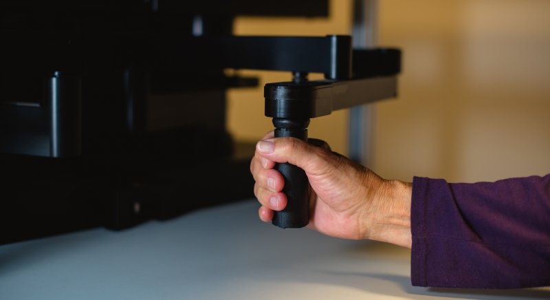 hand holding robotic handle
