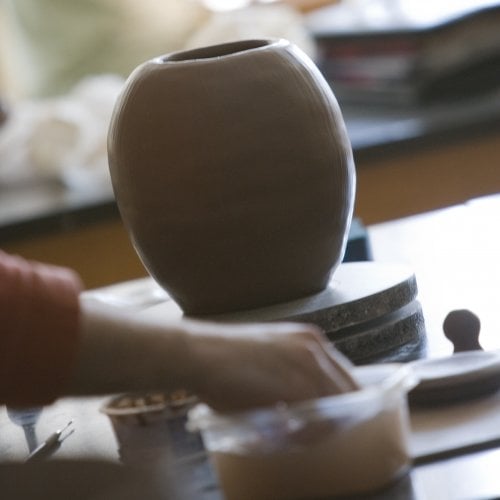 Student working on the potter's wheel