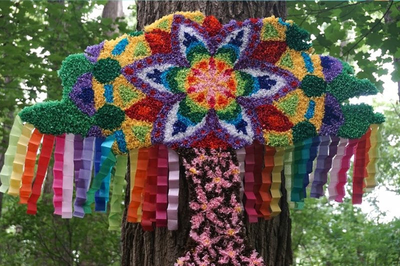 A colorful kite in the woods