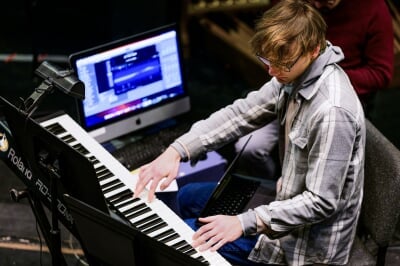 Keyboard player performs for Sweeney Todd production