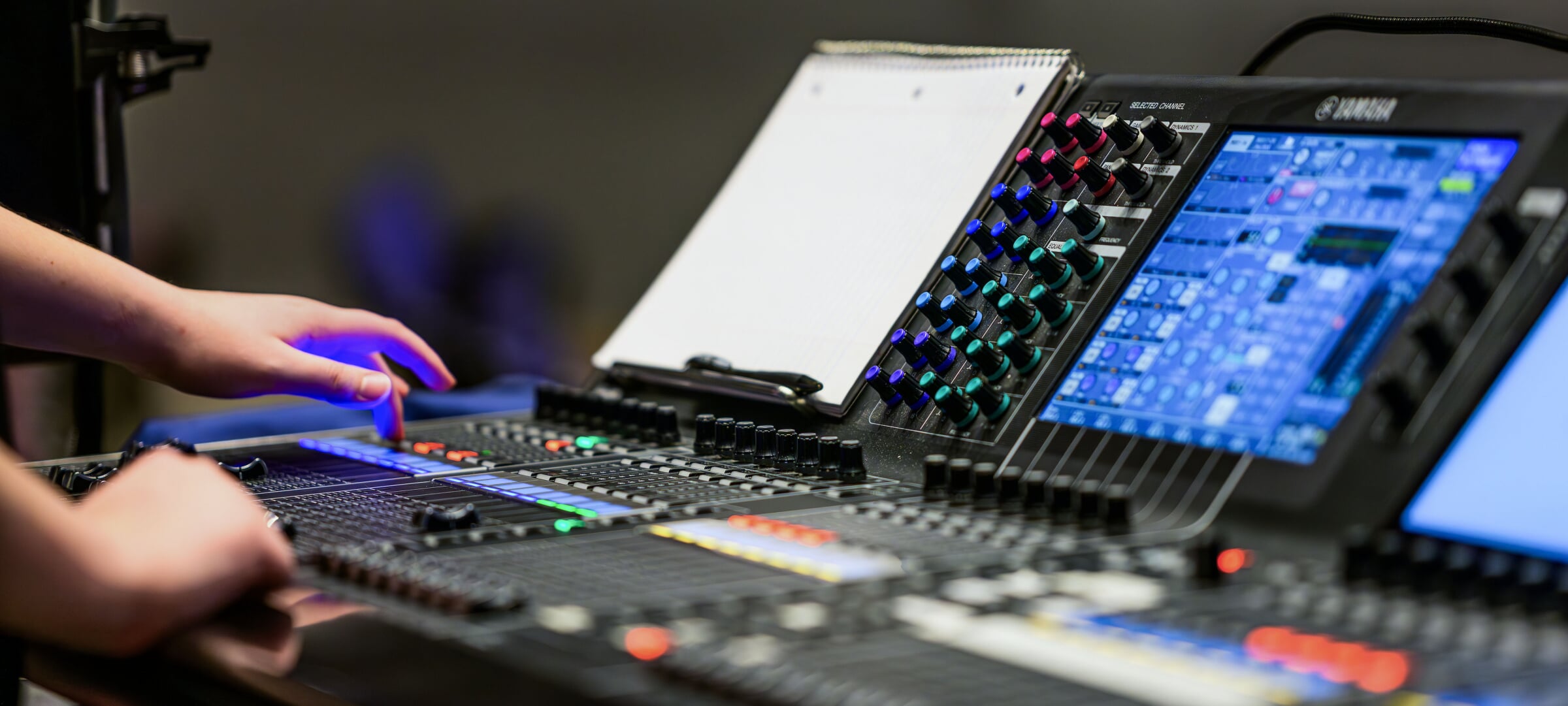 Student operating an audio control board