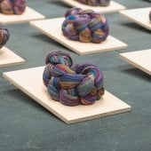 Close up of Trenzando/Braiding, 2017. Installation view. Cotton thread, plywood, Guatemalan quetzals, U.S. dollars. Photo by Adam Johnson.