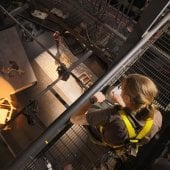 A student works in the lighting grid