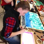 Student beginning a painting.