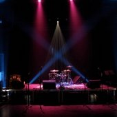 Empty stage set up for a music performance inside the McArdle Theatre.