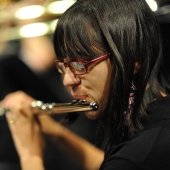 Student playing a flute.