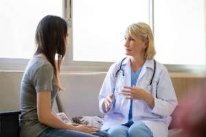 image of doctor talking to patient