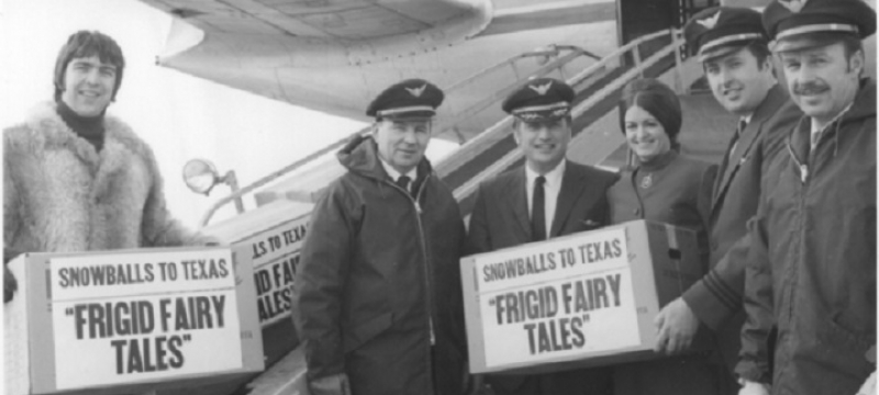 Boxes of "Frigid Fairy Tales" boxes snowballs are loaded on the plane. Pilots and others.